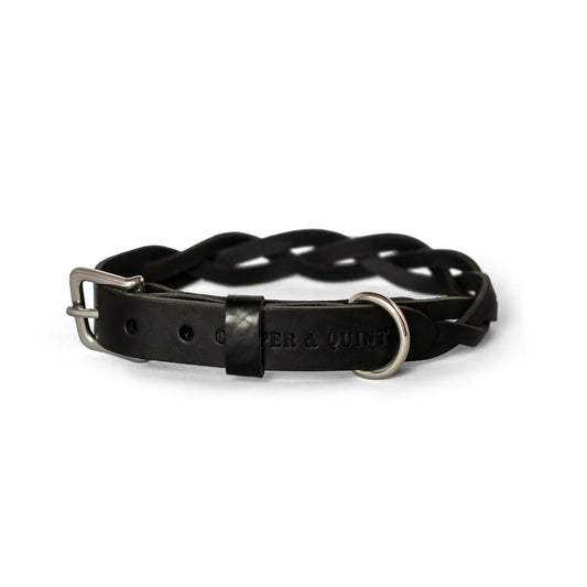 Black twisted leather dog collar with metal buckle and D-ring, handcrafted with unique braided design.