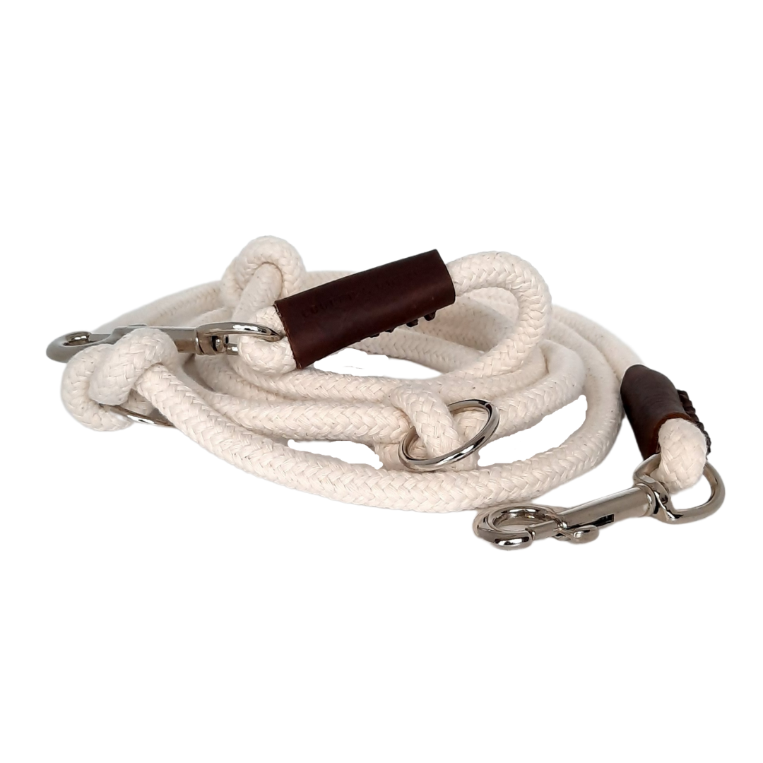 Adjustable Just Cotton dog leash made of 8mm thick ecru cotton rope with silver hooks and brown leather accents.