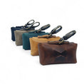 Afbeelding geladen in Galerij-viewer, Set of Cooper & Quint plant-dyed leather dog waste bag holders in various colors with clips for leashes or keychains
