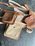 Afbeelding geladen in Galerij-viewer, Handmade leather doggybags with bronze fittings, multiple front pockets, and adjustable straps for hip or crossbody wear.