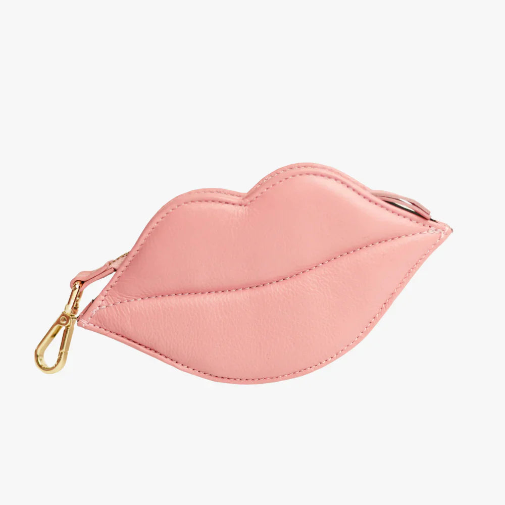 Pink lip-shaped leather dog waste bag holder with clip.