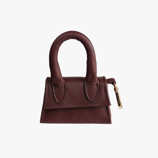 Bordeaux red designer dog treat and waste bag holder.